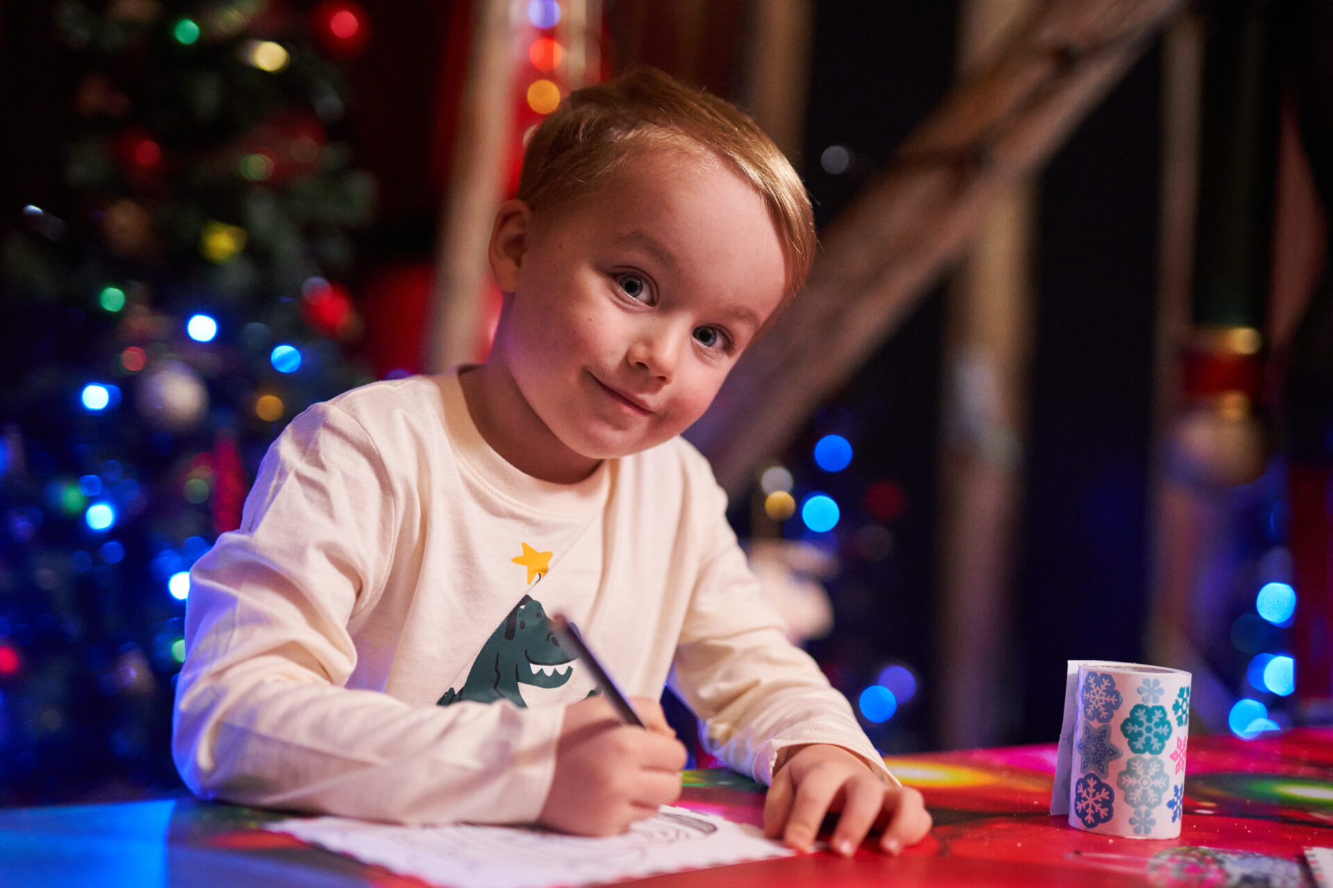 Christmas in Salisbury - child writing letter to santa in the Salisbury Christmas Santa's Grotto