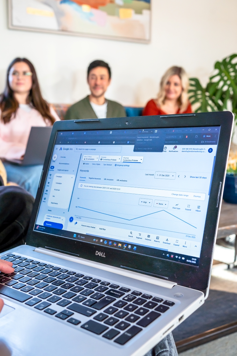 laptop marketing graph in landon marketing office